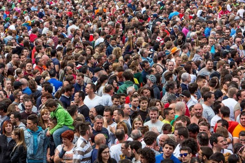 Densely packed crowd at a public festival