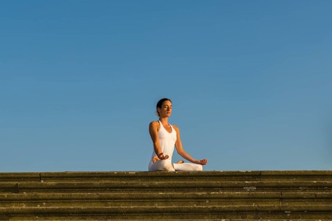 Young woman practising Hatha yoga