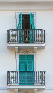Balconies with turquoise shutters