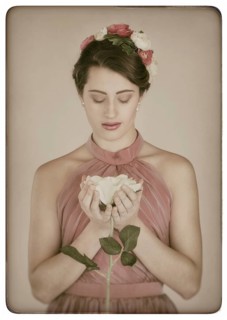 Beauty portrait of a young woman with flowers in her hair