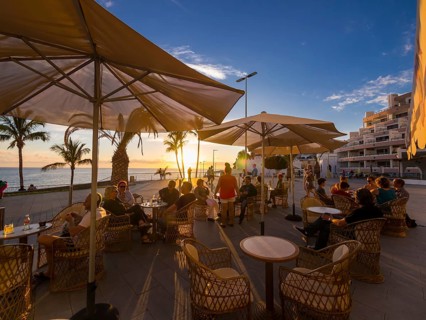 Beach promenade with restaurants in the evening