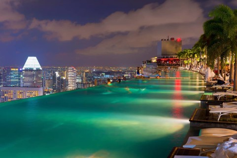 Downtown central financial district at night viewed from the Infinity pool of the Marina Bay Sands