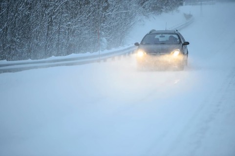 Truck driving on snowy road