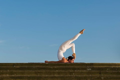 Young woman practising Hatha yoga