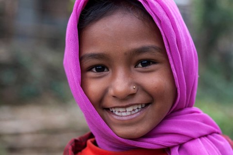 Smiling Nepalese girl with purple headscarf
