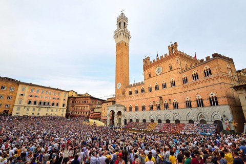 Piazza del Campo with Palazzo Publico on a training day of the Palio di Siena