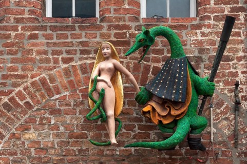 Figures of a dragon and a woman on the facade of the former Hieronymus Restaurant & Cafe