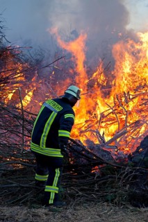Firefighter lighting Easter fire
