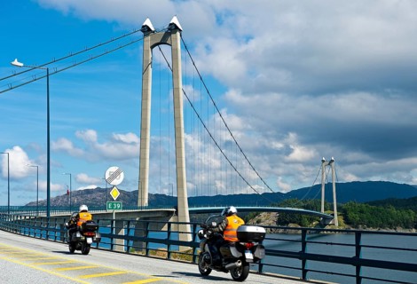 Motorcycles on the European Road E39 at Stord Bridge or Stordabrua suspension bridge across the sound of Digernessundet