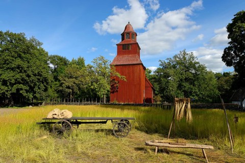 Wooden red Seglora Church or Seglora kyrka