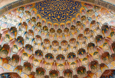 Decorative muqarnas vaulting in the iwan entrance of Abdulaziz Khan Madrassah