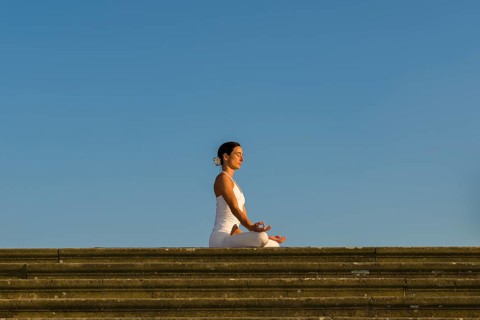 Young woman practising Hatha yoga