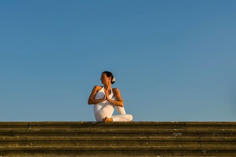 Young woman practising Hatha yoga