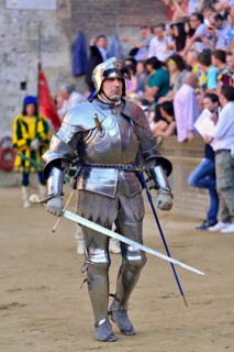 Knight in armor at the parade before the historical horse race Palio di Siena