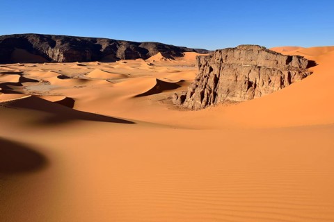 The sand dunes and rocks of Moul Naga