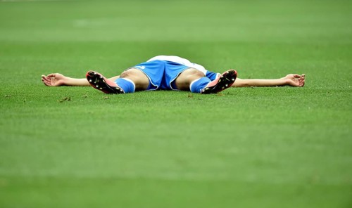 Injured football player lying on the ground