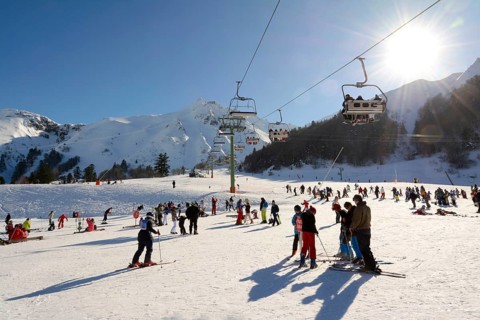 Skiers on the ski slopes at Le Mont Dore ski resort