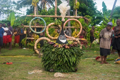Traditional masked man at a Taboo death ceremony