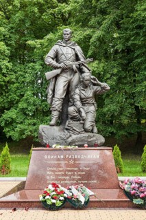 Young woman with a two-way radio set and an armed soldier