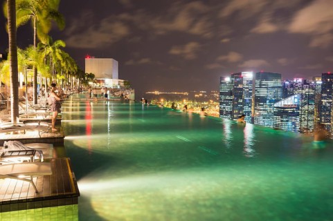 Downtown central financial district at night viewed from the Infinity pool of the Marina Bay Sands