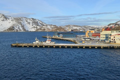 Pier with boat in bay