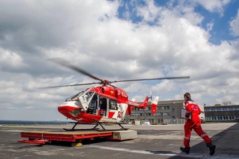 A paramedic running to a rescue helicopter of the DRF air rescue