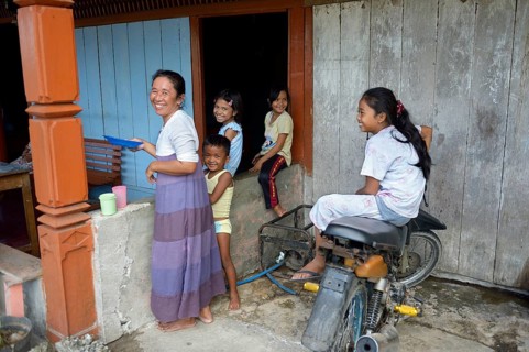 Smiling woman and children