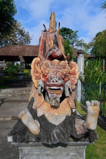 Seated dragon figure at the Tirta Gangga Water Temple