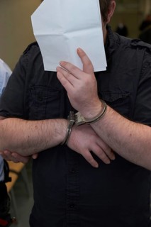 Defendant in handcuffs