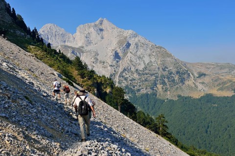 Group of hikers on a trail towards Kom Ljevorijecki