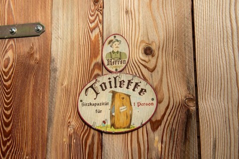 Sign toilet men at wooden door