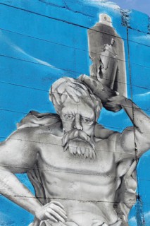 Greek mythical figure Sisyphus carrying a paint spray can