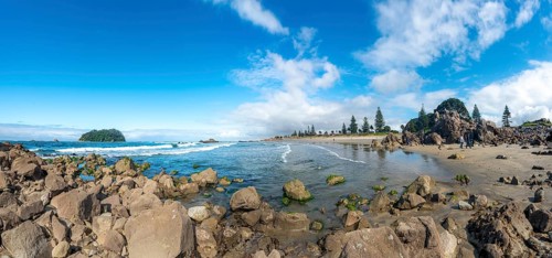Sandy beach beach of Mount Manganui with island Motiti Island