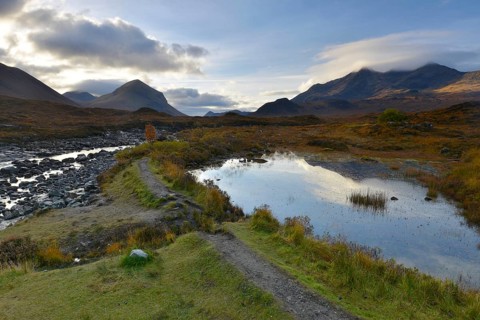 Small lake in front of the Black Cullins Mountains