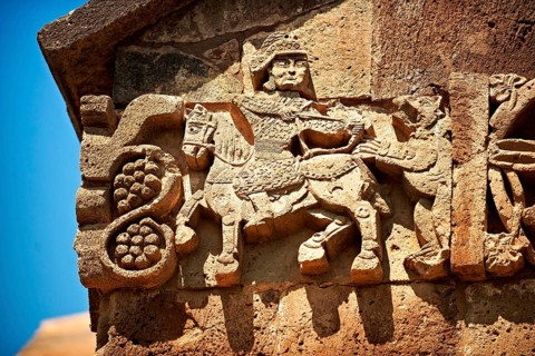 Bas-relief sculpture of a hunter in armour shooting an animal on the outside of the 10th century Armenian Orthodox Cathedral of the Holy Cross on Akdamar Island