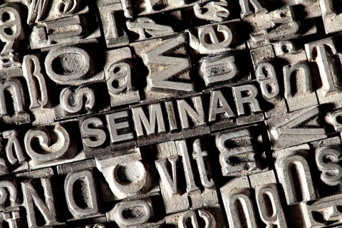 Old lead letters forming the word SEMINAR