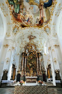 Altar and ceiling frescoes in the church