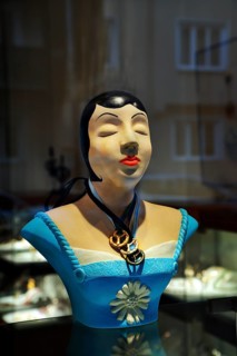 Bust wearing jewellery pendants