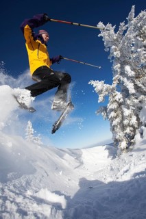 Snowshoe hiker jumping