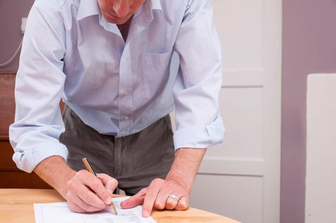 Man signing contract