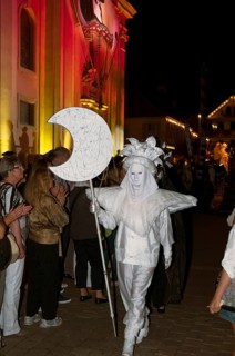 Parade of mask wearers in front of the historic municipal church