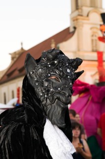 Costume with a devil mask