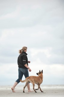 Woman with a Hollandse Herdershond