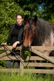 Woman with a Belgian Draft Horse at a fence