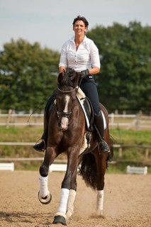 Woman riding a Hanoverian horse