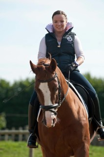 Woman riding a Hanoverian horse