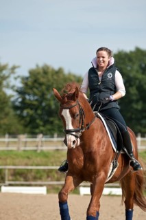 Woman riding a Hanoverian horse