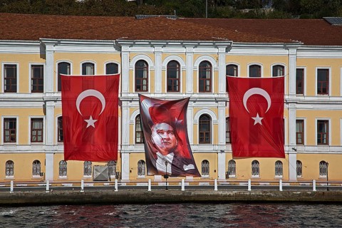 Flags of Musatafa Kemal Ataturk and Turkey flying on a building in honour of the anniversary of his death on 10 November 1938