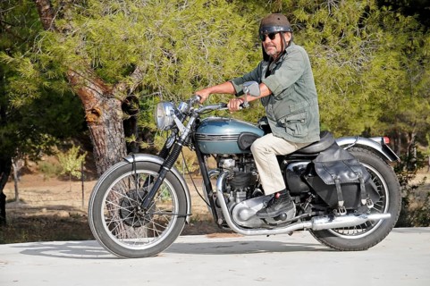 Elderly man riding a Triumph Tiger 500cc motorbike