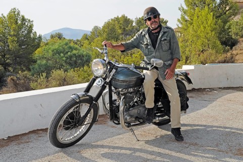 Elderly man sitting on a Triumph Tiger 500cc motorbike